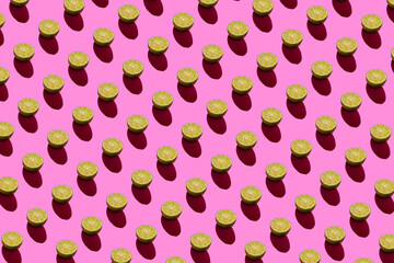 Lime pattern on a pink background. Pop art design, creative citruses. Yellow lemon, minimal flat style.