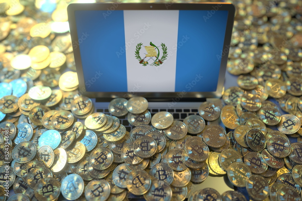 Poster computer with flag of guatemala and pile of bitcoins. national regulations and cryptocurrency mining