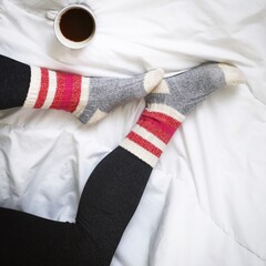 cozy coffee at home in bed with socks