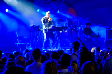 Crowd listening to concert in club