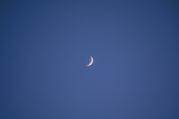 A new moon in the blue skies