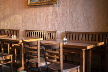 Wooden chairs and tables in cafeteria
