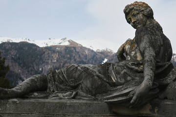 Statue with Carpathians in the background in Peles Castle in Romania