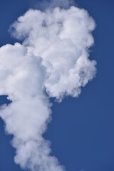 Smoke Plume cloud From Rocket Exhaust with a blue Sky  Clear sunny Day Fog and cloud atmosphere isolated