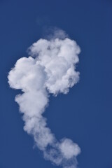 Smoke Plume cloud From Rocket Exhaust with a blue Sky  Clear sunny Day Fog and cloud atmosphere isolated