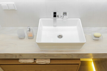 Modern white bathroom sink with faucet