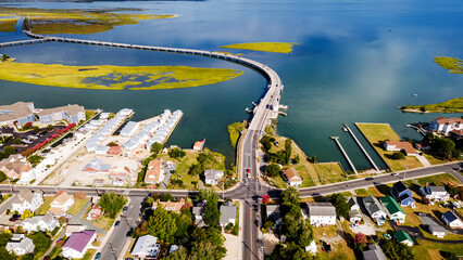 Chincoteague bridge across the Chincoteague Bay in Virginia and views of the waterfront. Drone view.
