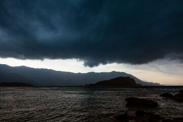 Dark clouds over the sea . Thunderstorm clouds with storm over water 