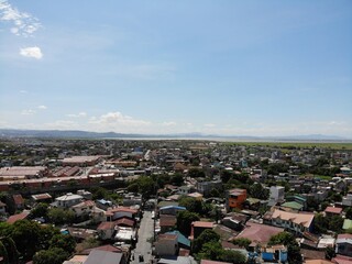 Aerial shot of residential areas in Philippines overlooking a mountain