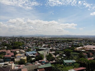 Aerial shot of residential areas in Philippines overlooking a mountain