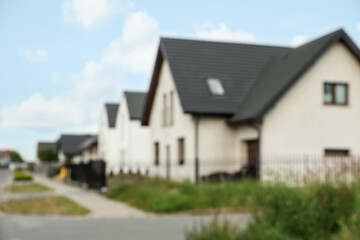 Blurred view of street with beautiful houses