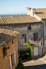 Fototapeta na wymiar VIew on medieval buildings in sunny day, vacation destination wine making village Chateauneuf-du-pape in Provence, France