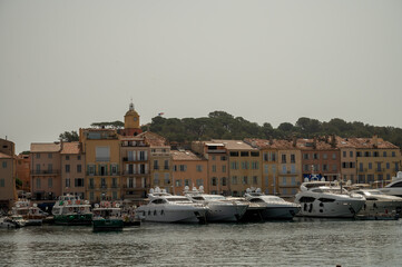 Fototapeta premium Colorful houses and yachts in Port of Saint Tropez, village on Mediterranean sea with yacht harbour, Provence, France