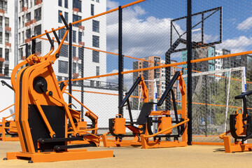 Street workout gym with stepper and fitness equipment outdoors in the residential apartment...