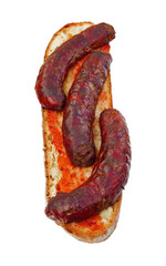 Grilled sausages chorizos on slice of bread spread with tomato  