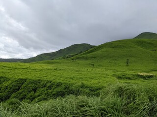 Japan's active volcano Mt. Aso grassland and clouds