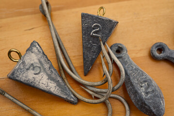A close up of fishing hooks and sinkers.