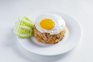 Fried rice with pork and egg in white dish on white background, Thai food, isolated background