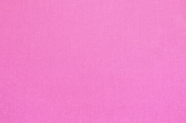 Close-up texture of natural weave cloth. Cherry pink fabric background. Natural cotton textile material.