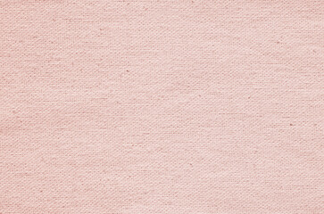 Close-up texture of natural weave cloth. Rose pink fabric background. Natural linen or cotton textile material.