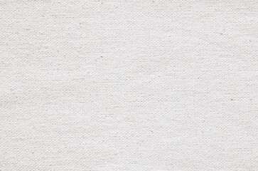 Close-up texture of natural weave cloth. White fabric background. Natural linen or cotton textile material.