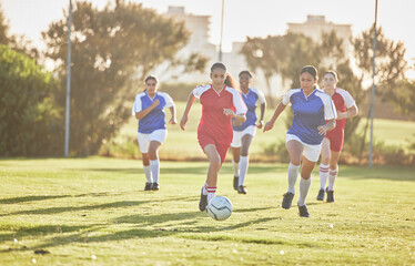 Female football, sports and team playing match on a field while passing, touching and running with...