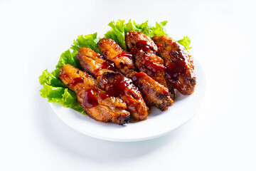 Stir fried chicken fillet with sauce in a white plate on white background, Thai food, isolated on...