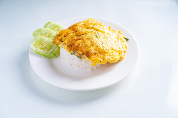 Rice with omelet in white dish on white background, Thai food, isolated background