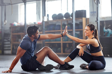 Gym wellness couple high five for success or good exercise and well done gesture for reaching...