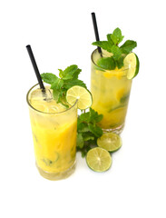 Mango mojito in highball glass with sliced mango isolated on white background