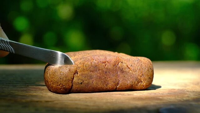 pinching off a slice of hashish for smoking close up. cannabis hash and metal stick for smoking weed. High quality FullHD footage
