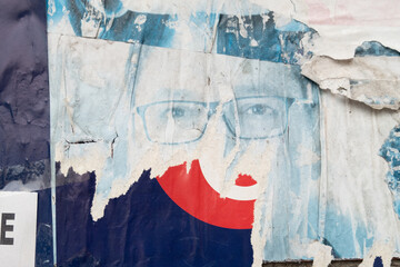 Fototapeta premium Torn grungy poster background. Abstract and ripped paper collage