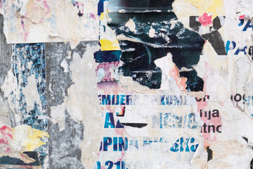Fototapeta premium Torn grungy poster background. Abstract and ripped paper collage