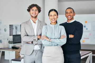 Teamwork, unity and togetherness with a corporate team portrait of colleagues standing arms crossed in their office at work. Young, motivated and ambitious business people with a mindset of growth