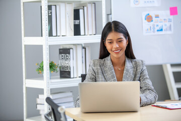 Portrait of Asian beautiful business woman working at the office, using computer. buiness concept. - 524383014