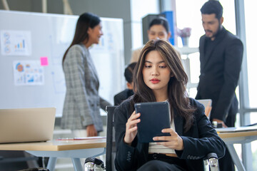 Obraz premium Portrait of Asian beautiful business woman working at the office, beautiful woman using touchpad with smile at working place.