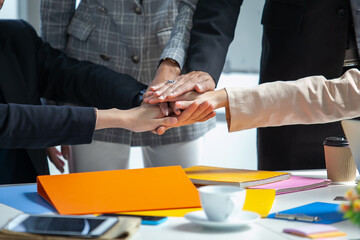 Teamwork Deal Cooperation Partnership business people giving hi-five before work in the office, touch hands for unity group to succuss business.