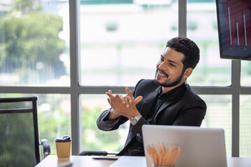 Asain businessman praising his colleague in the office, business concept.
