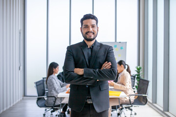 Portrait of Asian businessman working at the office, smart businessman with smile at working place.