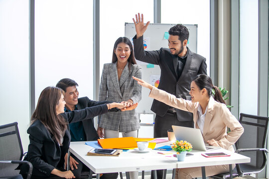 Teamwork Deal Cooperation Partnership business people giving hi-five before work in the office, touch hands for unity group to succuss business.