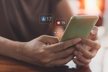 Social media, social network concept with smartphone. Woman hands using mobile smartphone with icon social media and marketing.