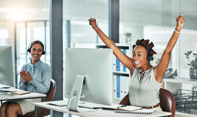 Call centre, cheerful and agent celebrating with arms up at her office desk. Successful,...