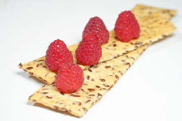 Ripe red raspberry is on the table