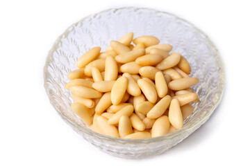 Healthy pine nuts isolated on white background.