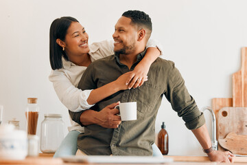 Happy, coffee and loving couple bonding and having fun while spending time together at home. Smiling, in love and carefree couple hugging and sharing a romantic moment while enjoying the weekend - Powered by Adobe