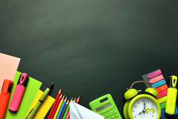 Background with school supplies: paper, pencils, calculator. Back to school