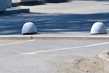 Mobile concrete parking fences on a summer day