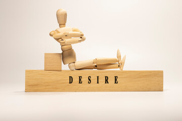 DESIRE is written on a wooden surface. Personal development and education