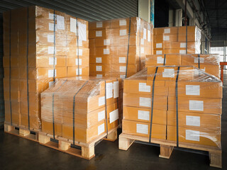 Package Boxes Wrapped Plastic Stacked on Pallets in Storage Warehouse. Supply Chain. Storehouse Distribution. Cargo Shipping Supplies Warehouse Logistics.	