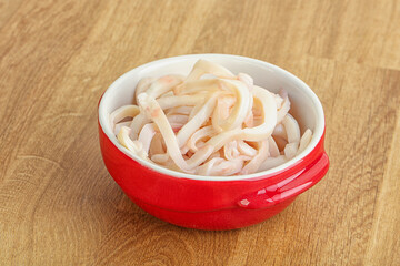 Marinated squid strips in the bowl